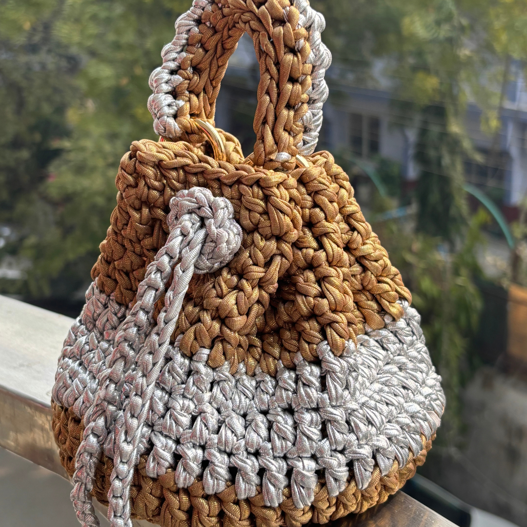 Shiroli_handmade_gold_and_silver_crochet_potli_bag image 1
